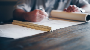 An engineer going through construction plans.