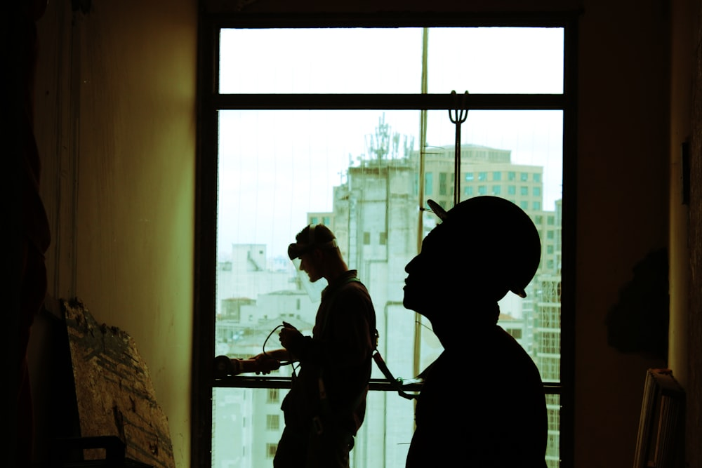 Two construction workers standing at a construction site 