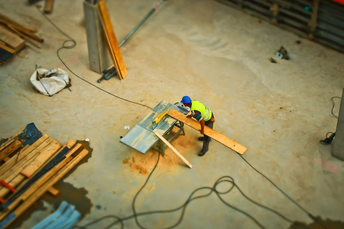  A construction worker cutting wood