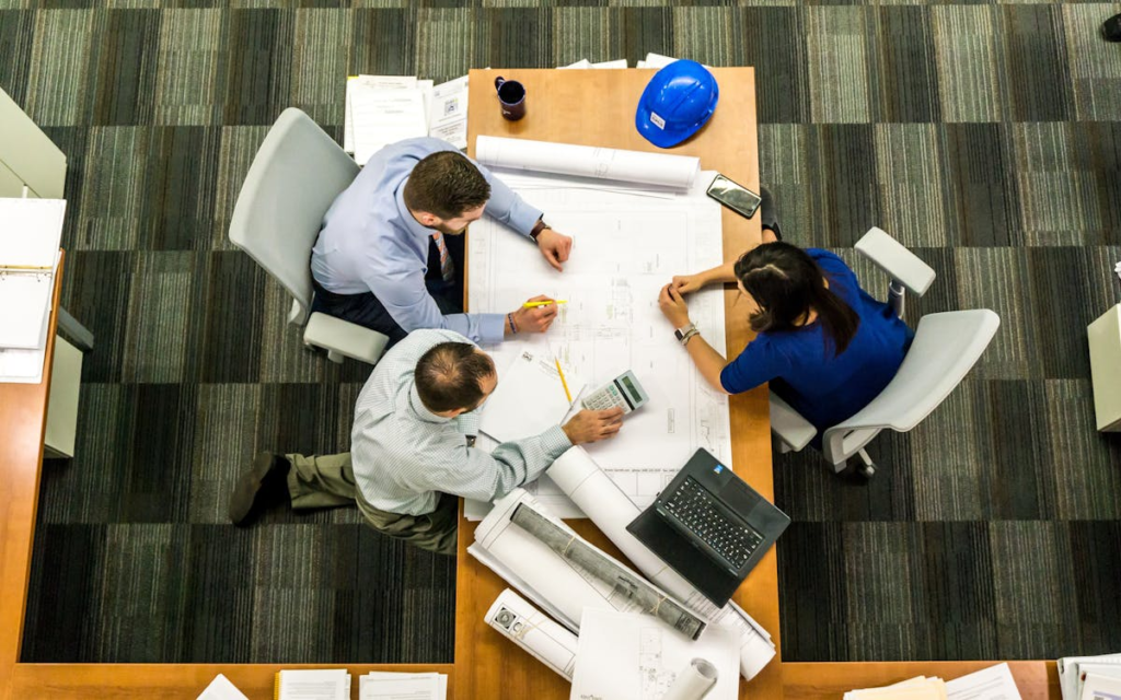 Three employees working in an office