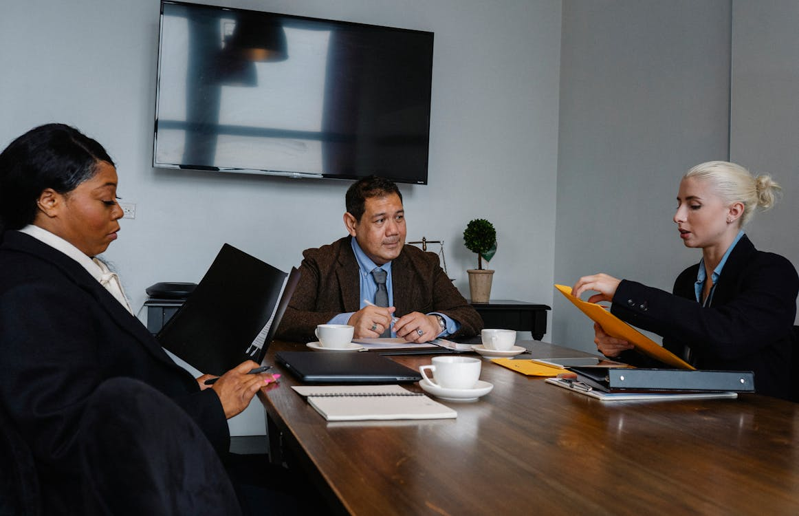 Three employees working in an office