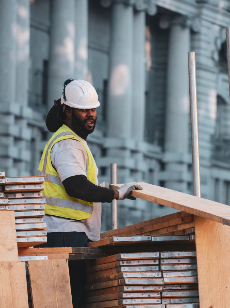 A worker welding materials for structural support