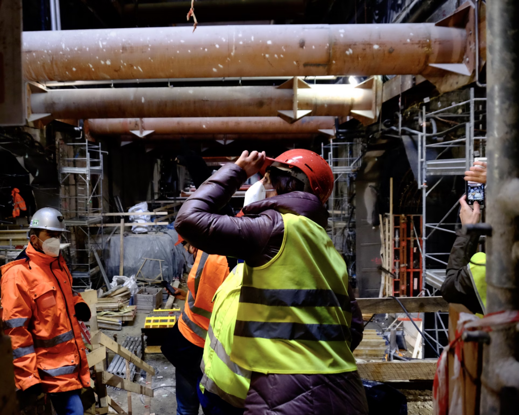 Construction workers performing site excavation for a project