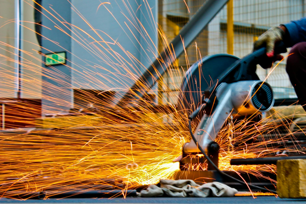 A construction worker uses a power saw.