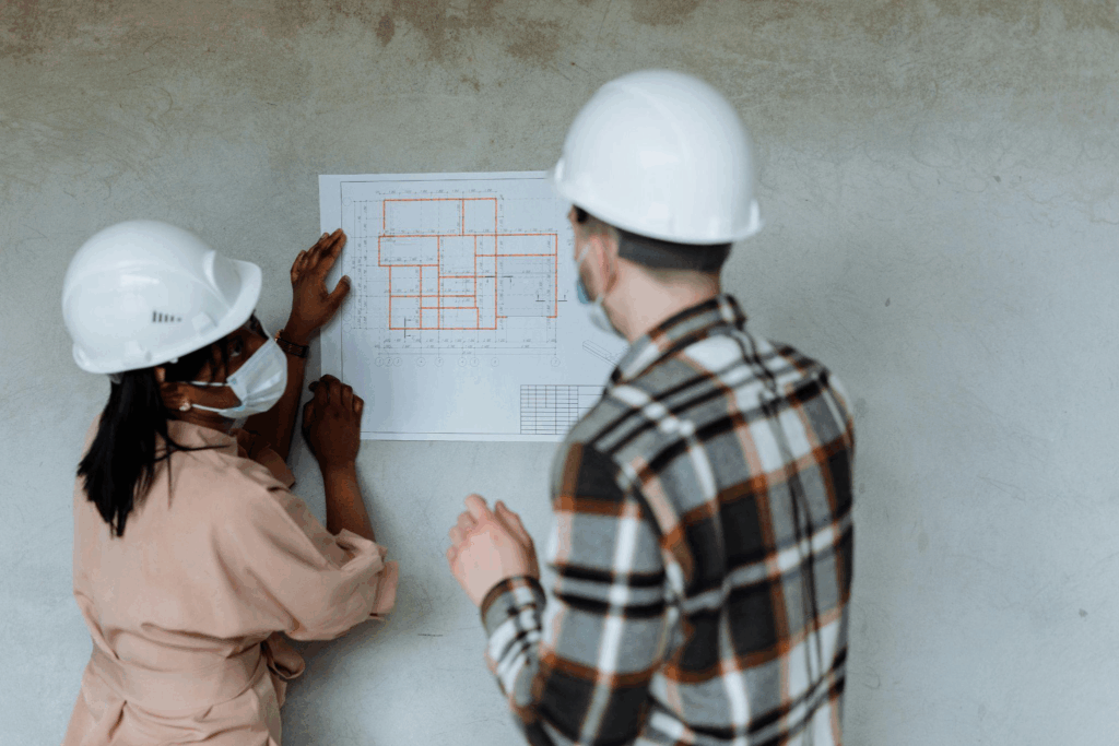  A construction site with professionals analyzing plans to solve project delays
