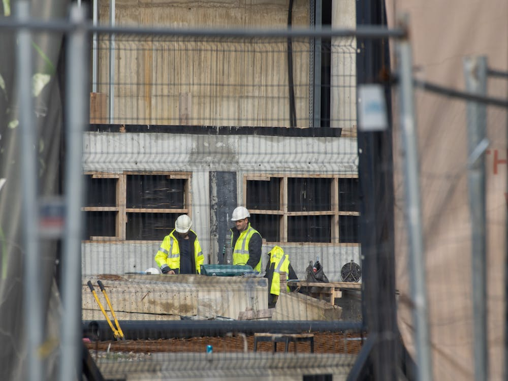 men in helmets working on a building site