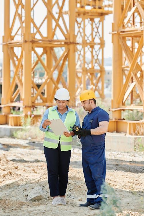 Construction site with workers reviewing plans
