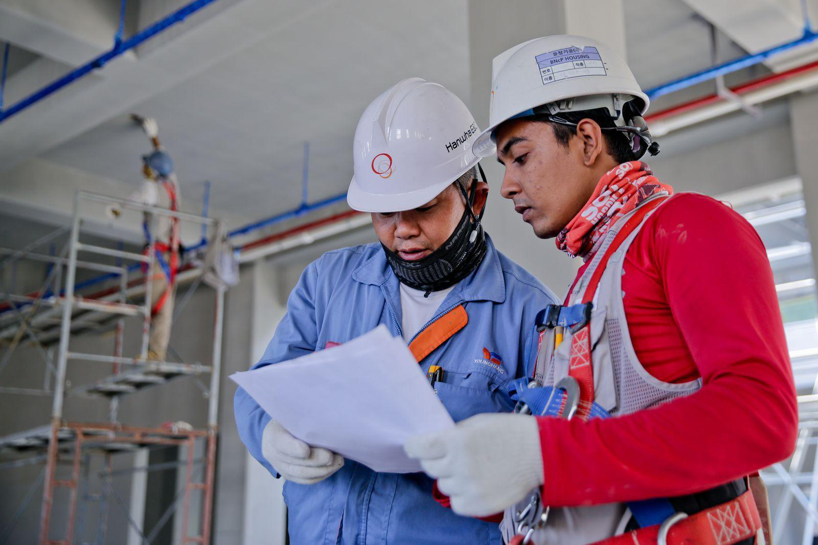 Engineers reviewing revised plans